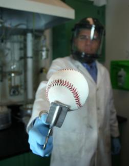 A photo of Fellow John Bohn with a baseball.