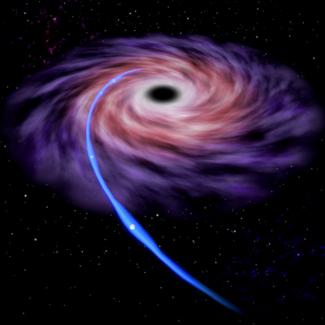 Image illustrating the the tidal disruption of a star by a supermassive black hole.