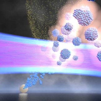 Illustration of shooting a stream of quantum dots into a vacuum chamber.